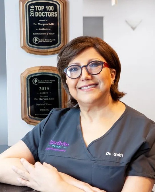 Dr. Maryam Seifi with her Doctors' Choice awards at StarBrite Dental in Rockville
