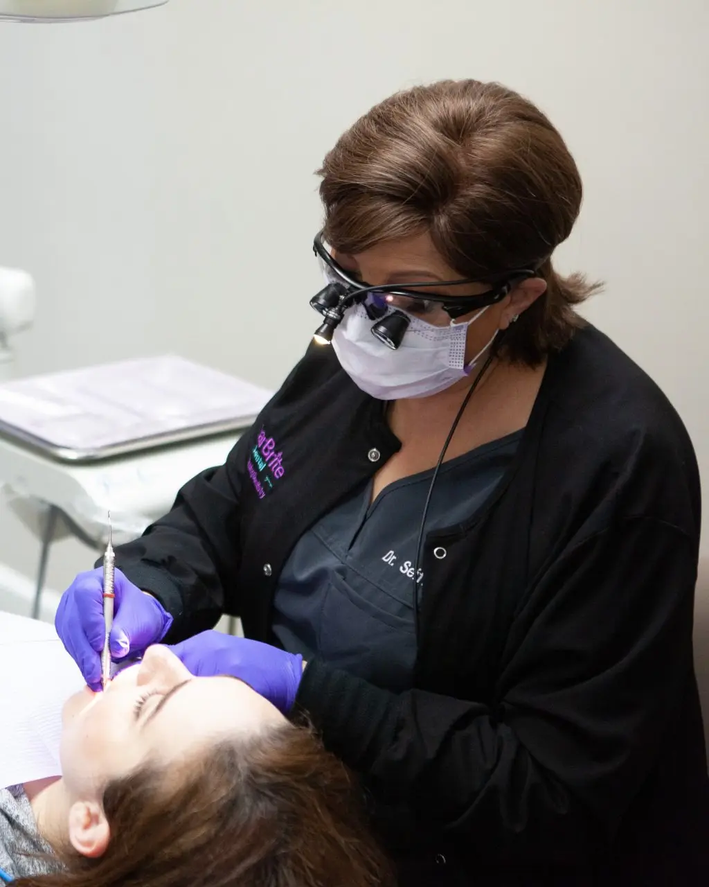 Dr. Maryam Seifi treating a patient at StarBrite Dental in Rockville